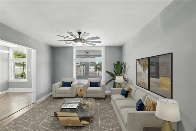 a living room with furniture and a large window