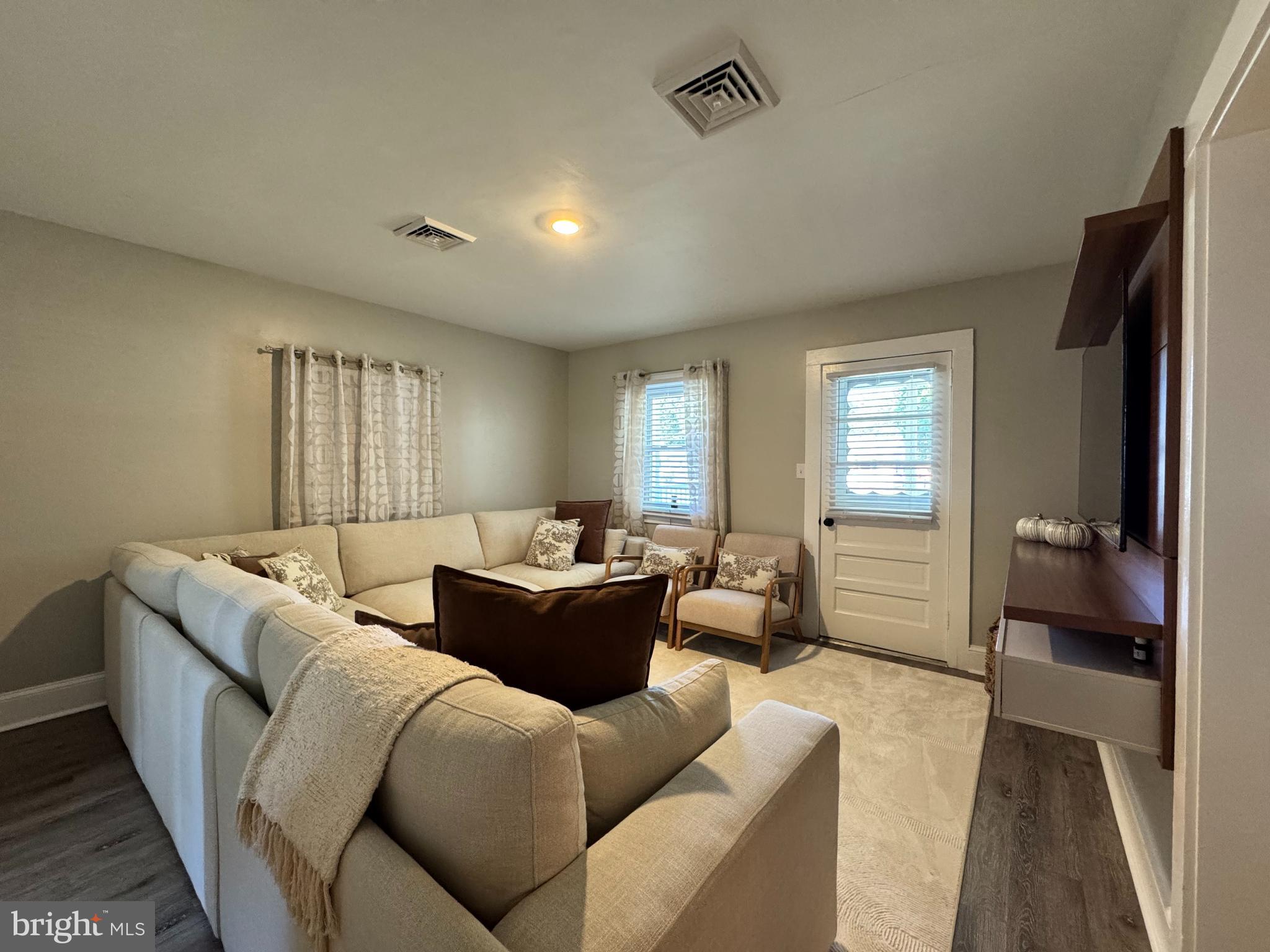 30483 Bennett Road Salisbury, MD 21804 - Photo 12 of 46 a living room with furniture and a large window