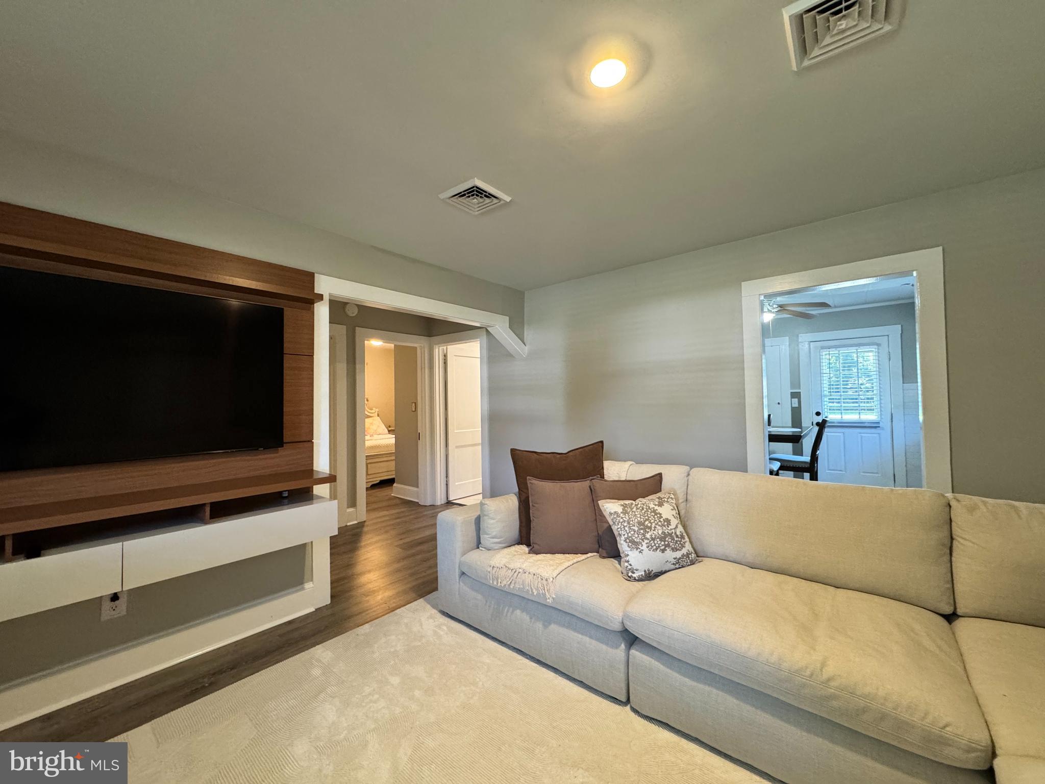 30483 Bennett Road Salisbury, MD 21804 - Photo 14 of 46 a living room with furniture and a flat screen tv