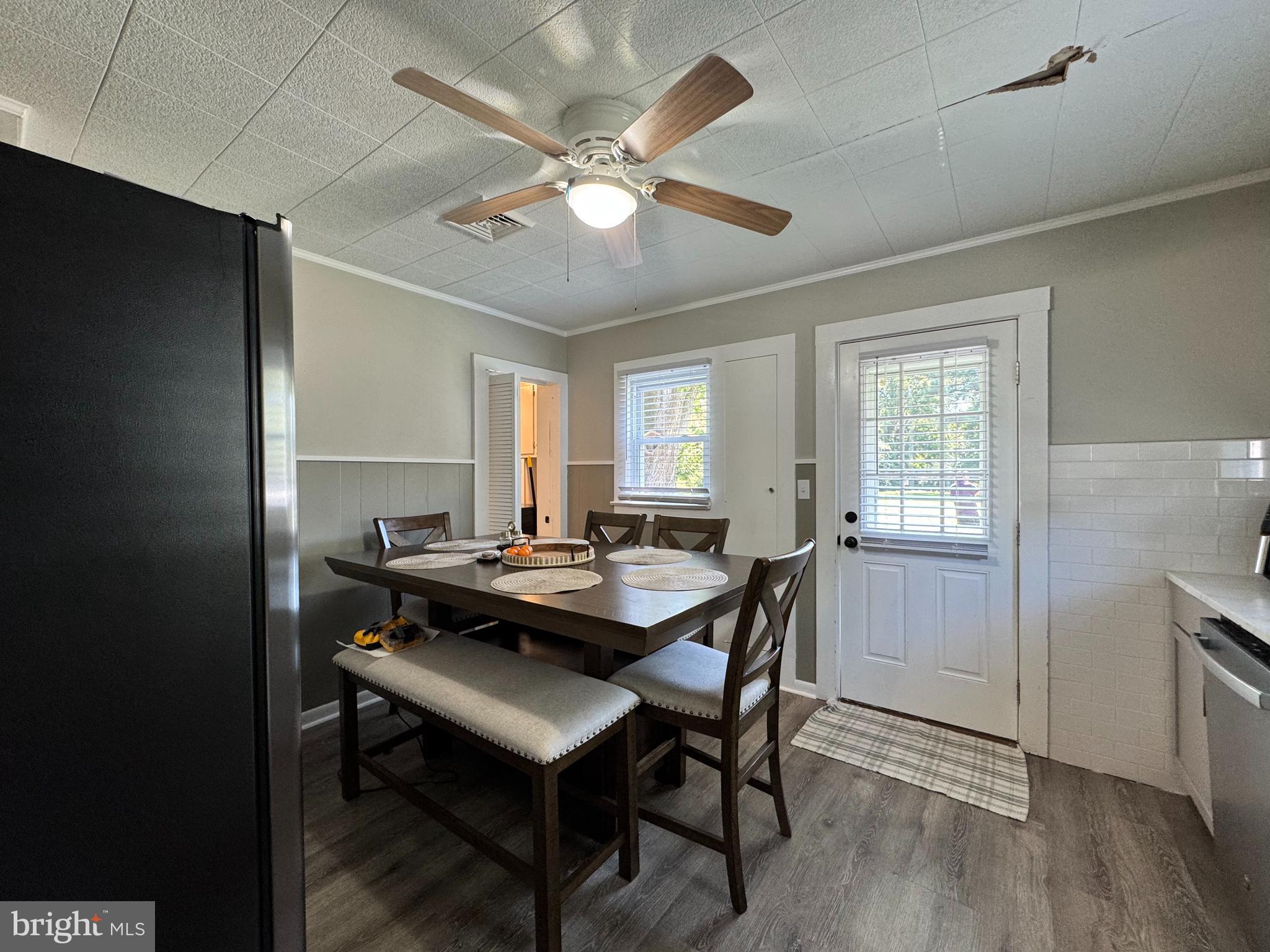 30483 Bennett Road Salisbury, MD 21804 - Photo 16 of 46 a view of a a dining room with furniture window and wooden floor