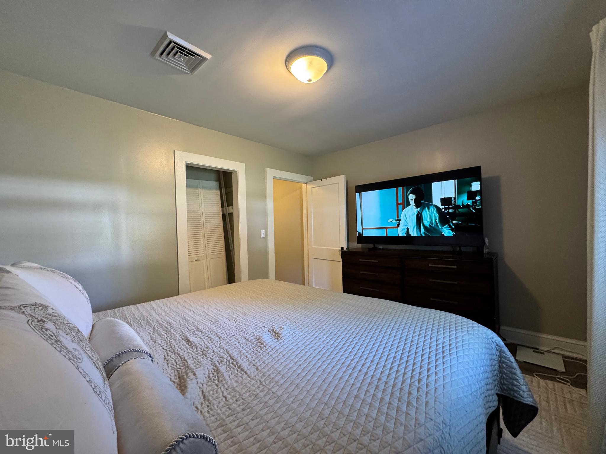 30483 Bennett Road Salisbury, MD 21804 - Photo 22 of 46 a bedroom with a bed and a television