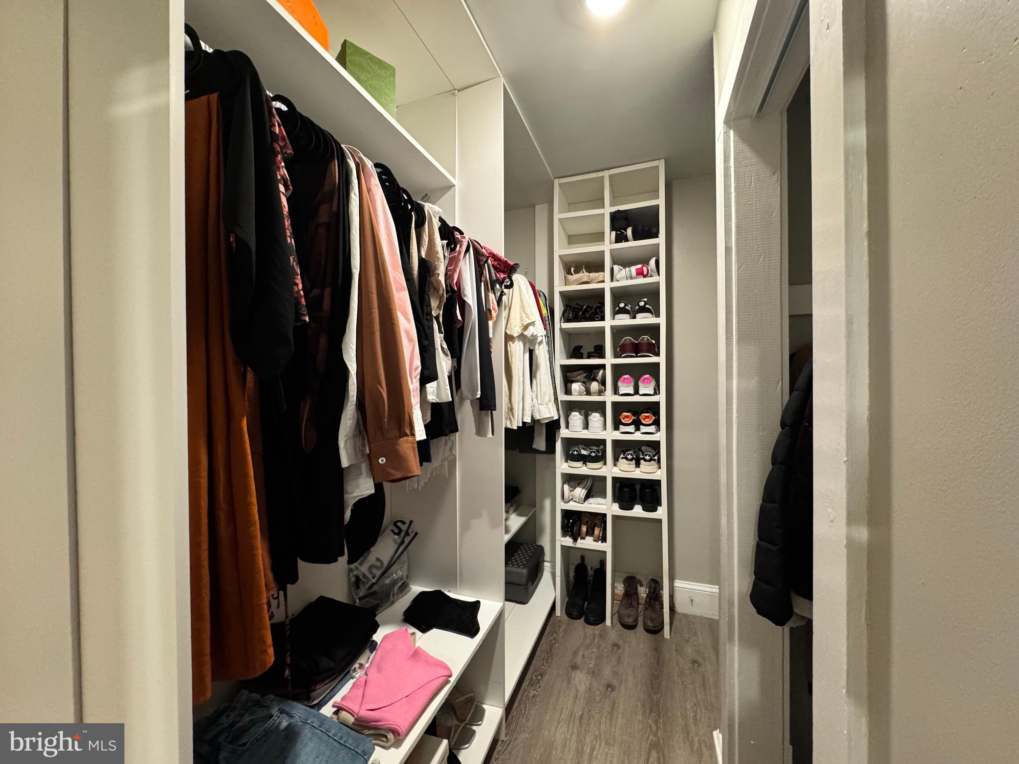 30483 Bennett Road Salisbury, MD 21804 - Photo 24 of 46 a view of walk in closet with clothes and shoes