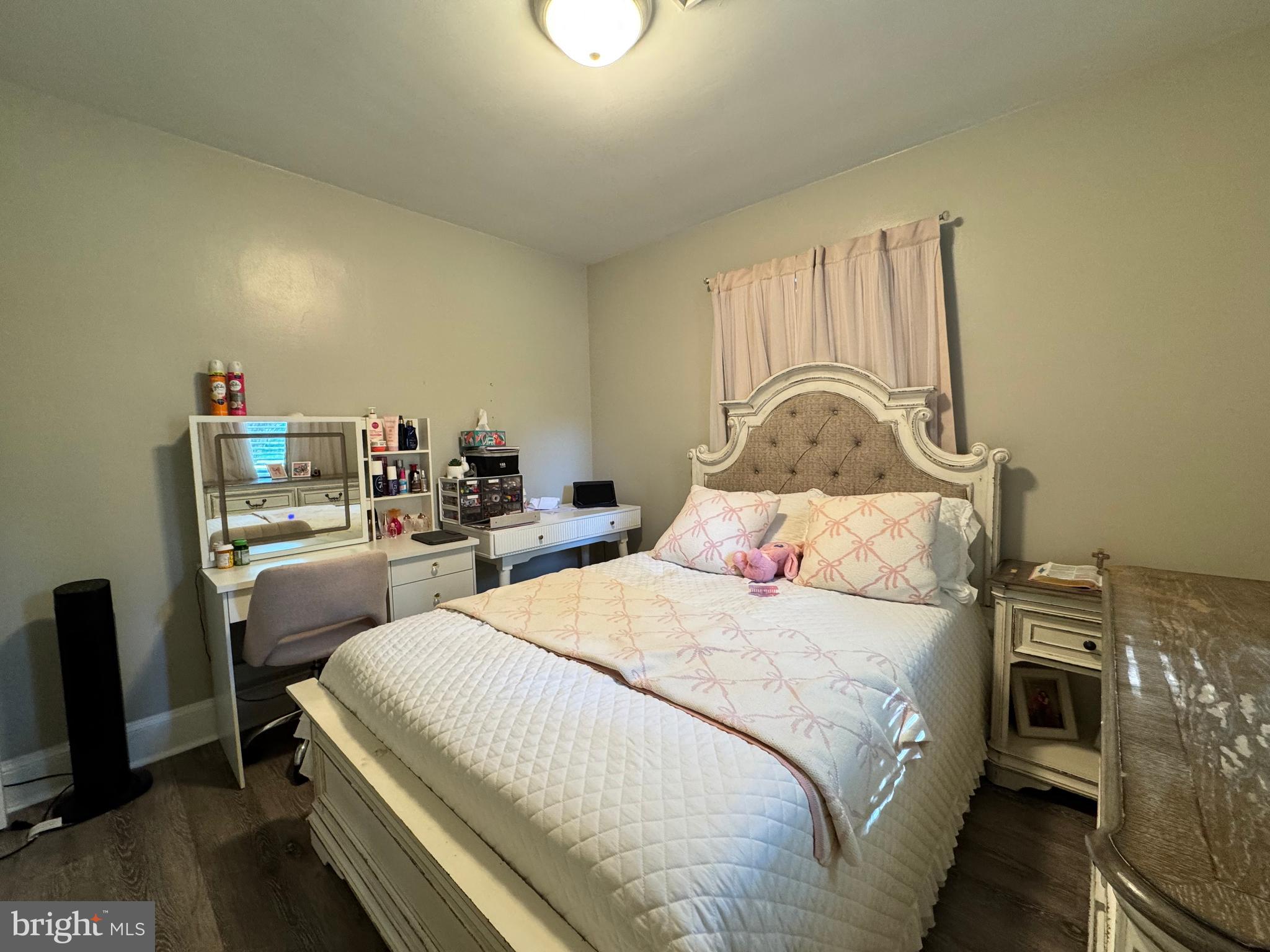 30483 Bennett Road Salisbury, MD 21804 - Photo 27 of 46 a bedroom with a bed and a dresser