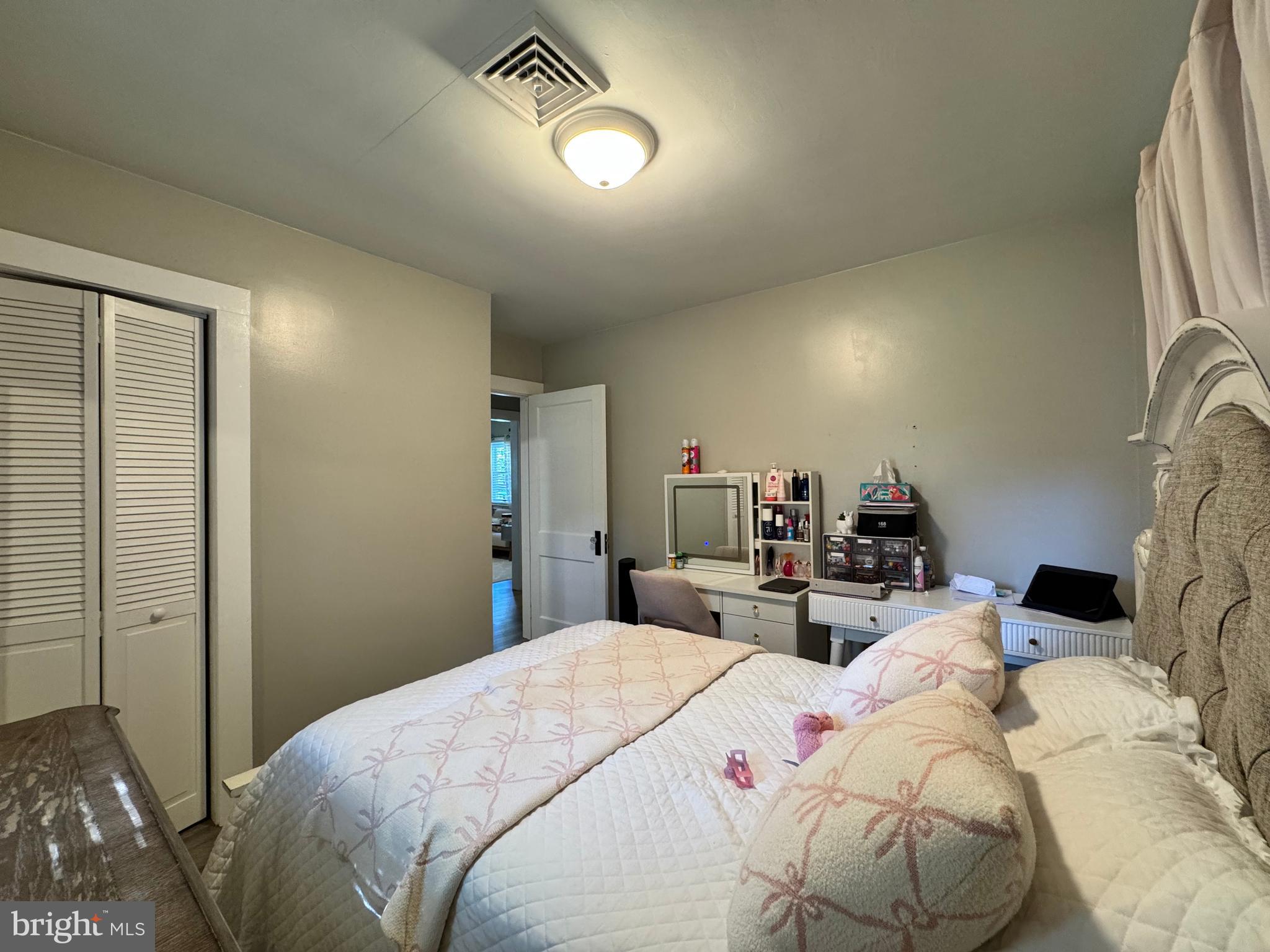 30483 Bennett Road Salisbury, MD 21804 - Photo 28 of 46 a bedroom with two beds and a chandelier