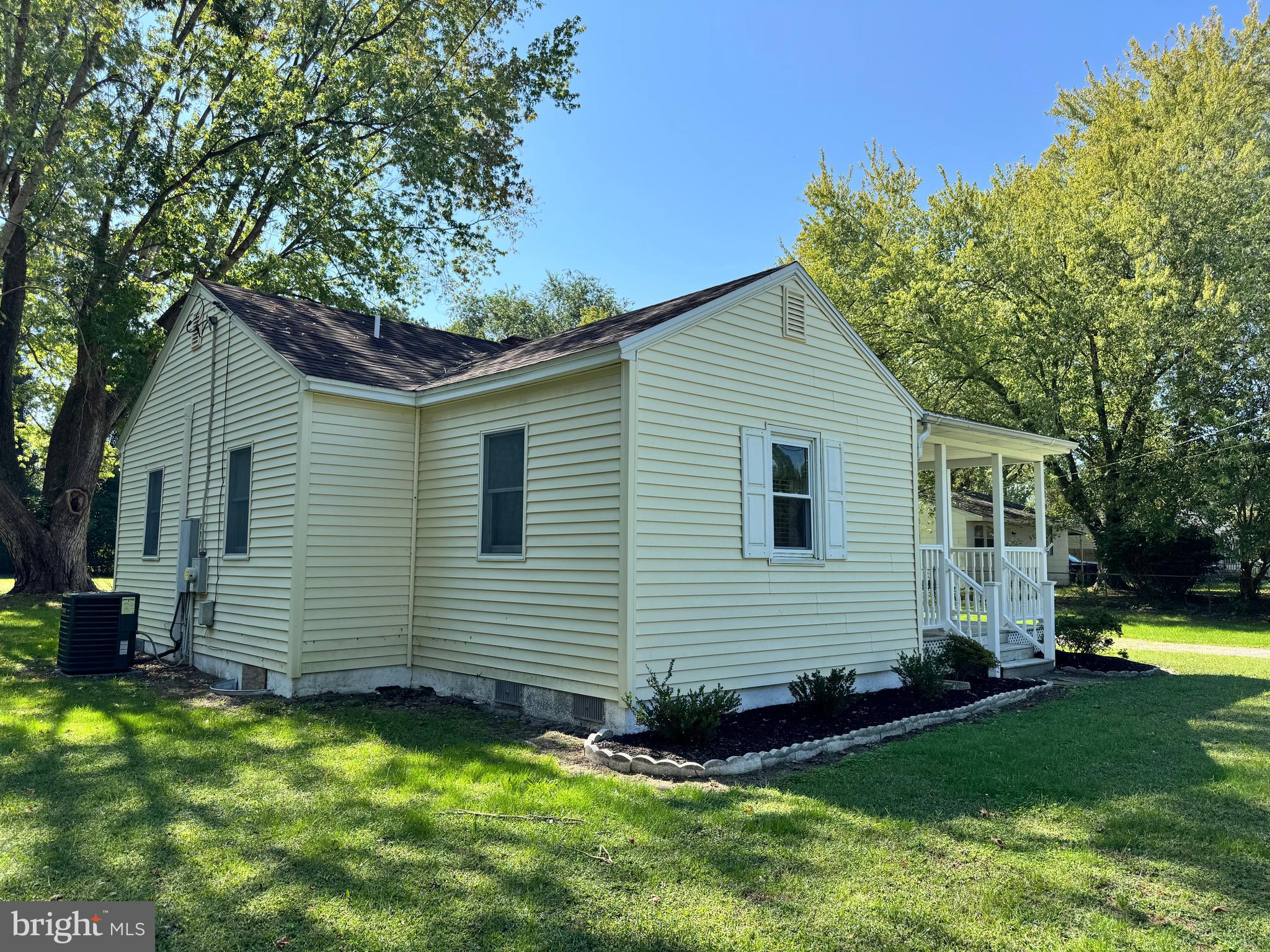 30483 Bennett Road Salisbury, MD 21804 - Photo 3 of 46 a front view of a house with a garden