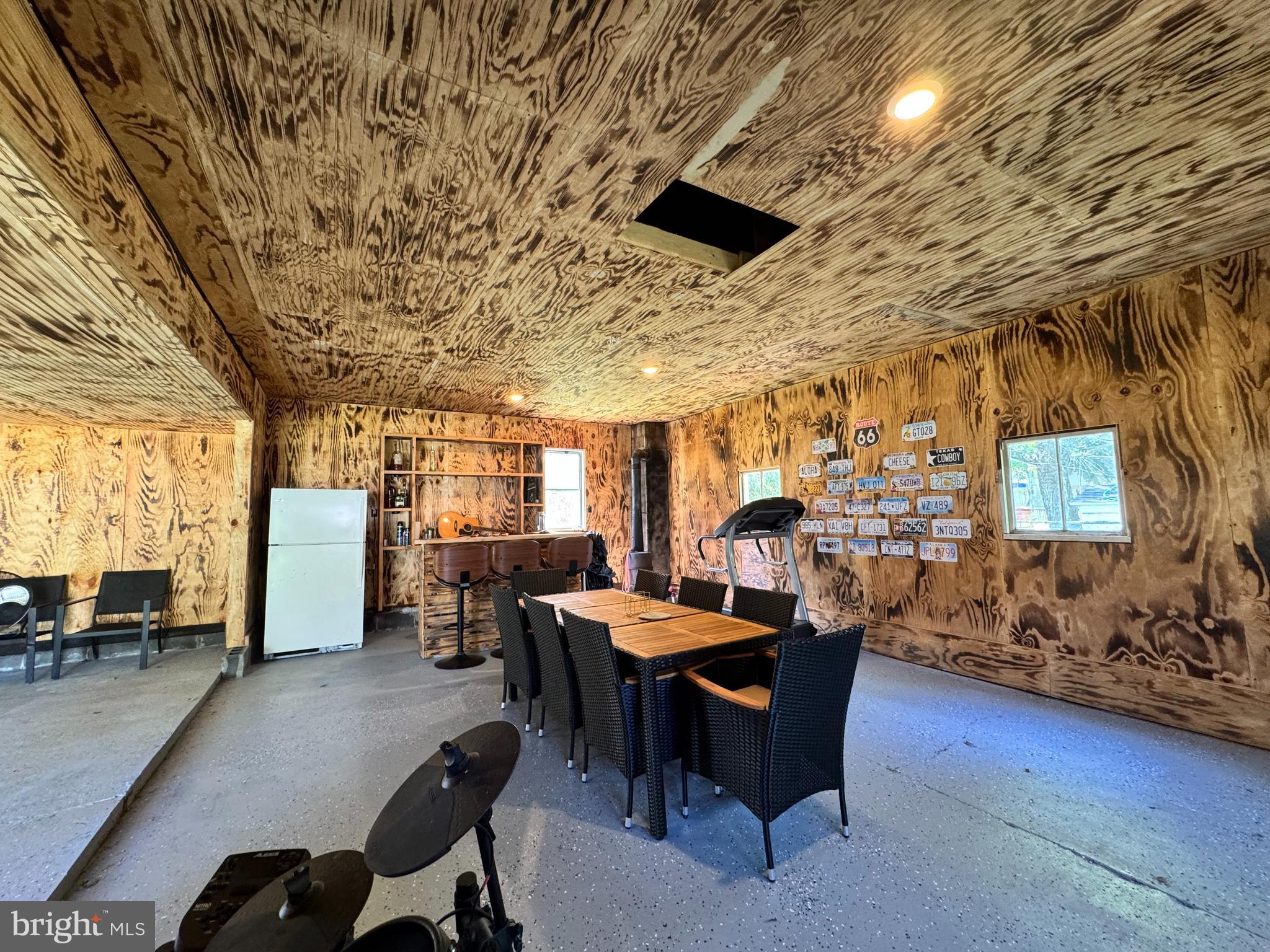 30483 Bennett Road Salisbury, MD 21804 - Photo 40 of 46 a dining room with furniture and a flat screen tv