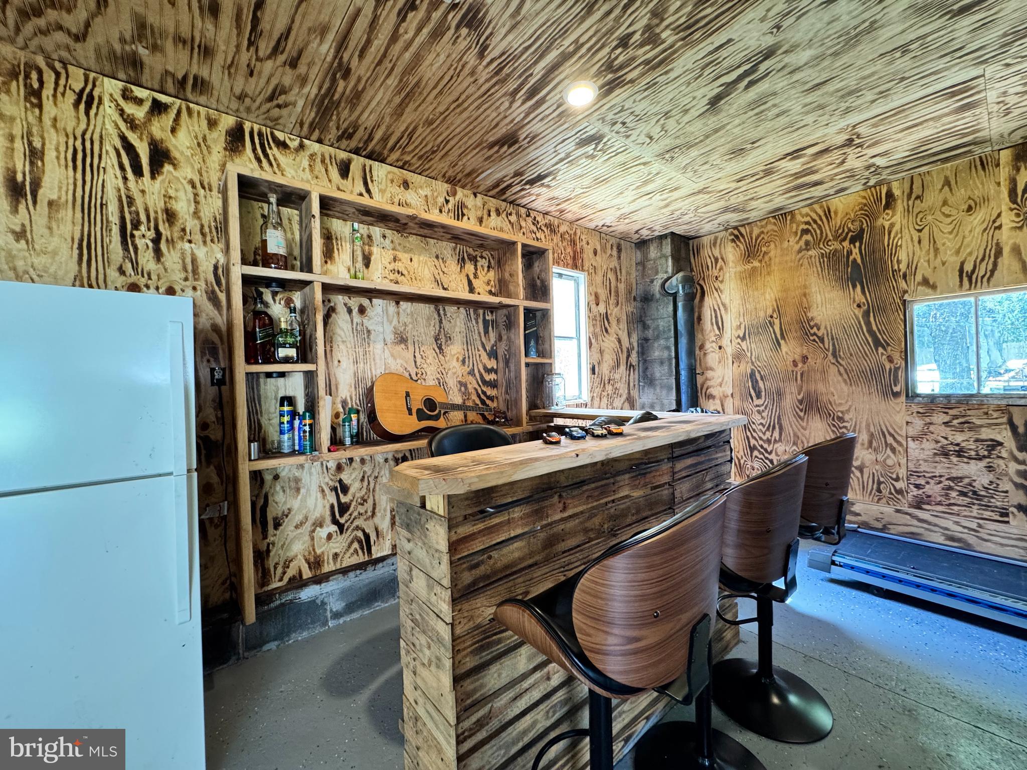 30483 Bennett Road Salisbury, MD 21804 - Photo 42 of 46 a kitchen with stainless steel appliances kitchen island granite countertop a table chairs and a refrigerator