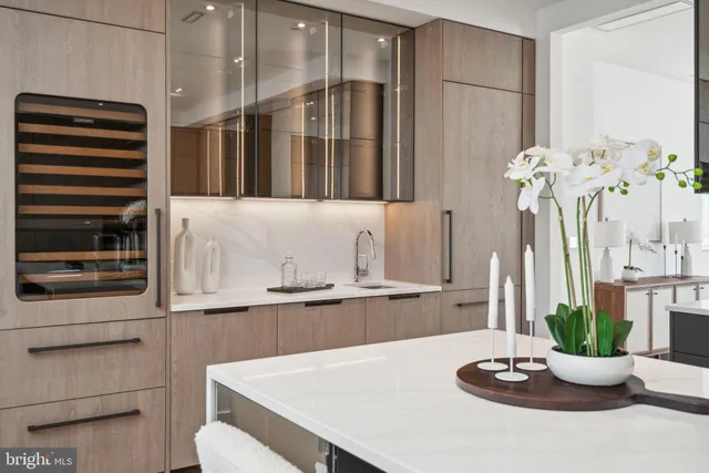 a kitchen with stainless steel appliances kitchen island granite countertop a sink and cabinets