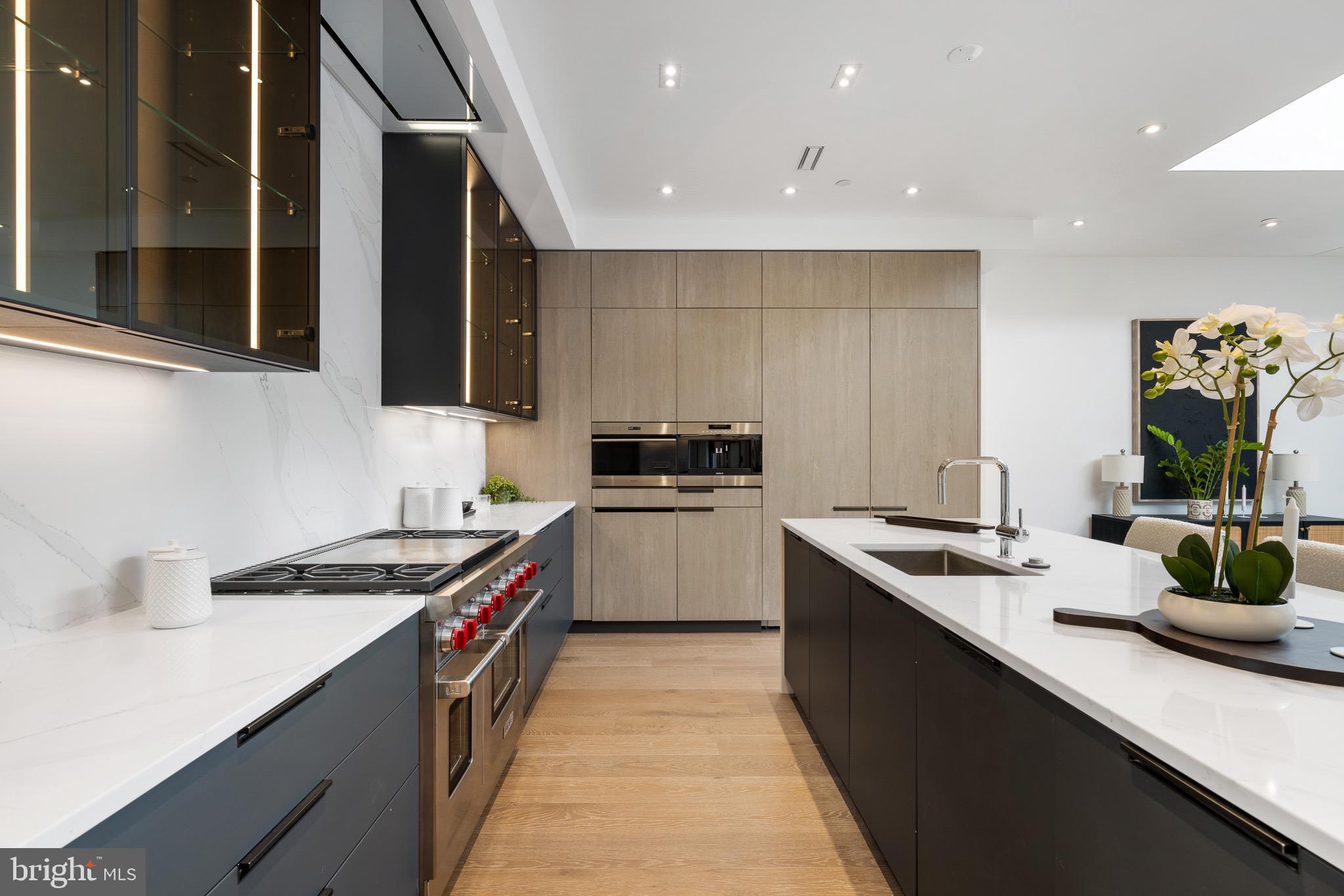 124 North 2nd Street, Unit PH Philadelphia, PA 19106 - Photo 15 of 69 a kitchen with a sink stove top oven and cabinets