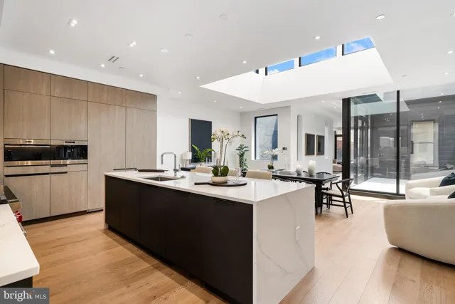 a room with furniture pool table and windows