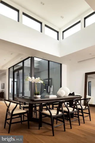 a view of a terrace with dining table and chairs