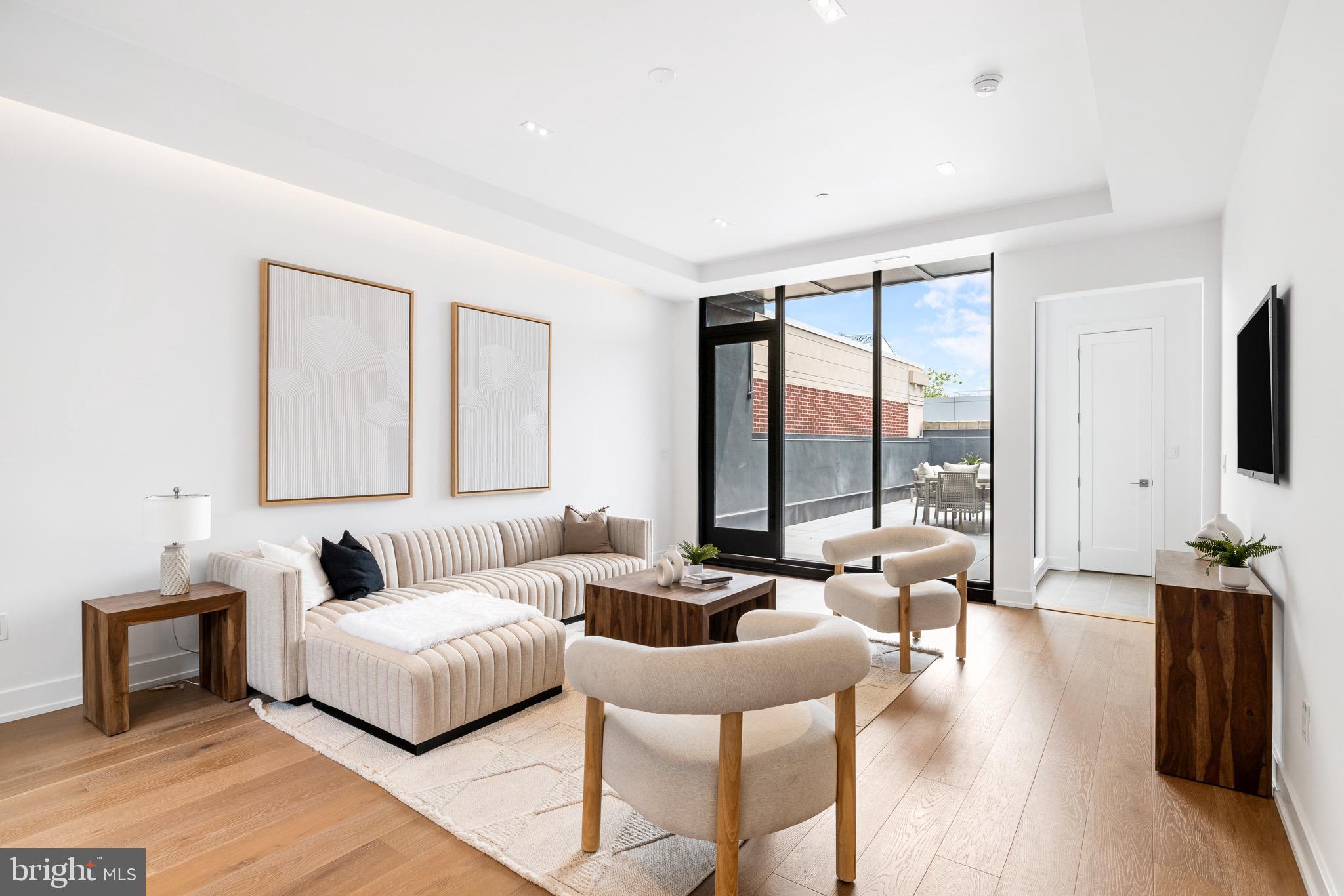 124 North 2nd Street, Unit PH Philadelphia, PA 19106 - Photo 29 of 69 a living room with furniture and a large window