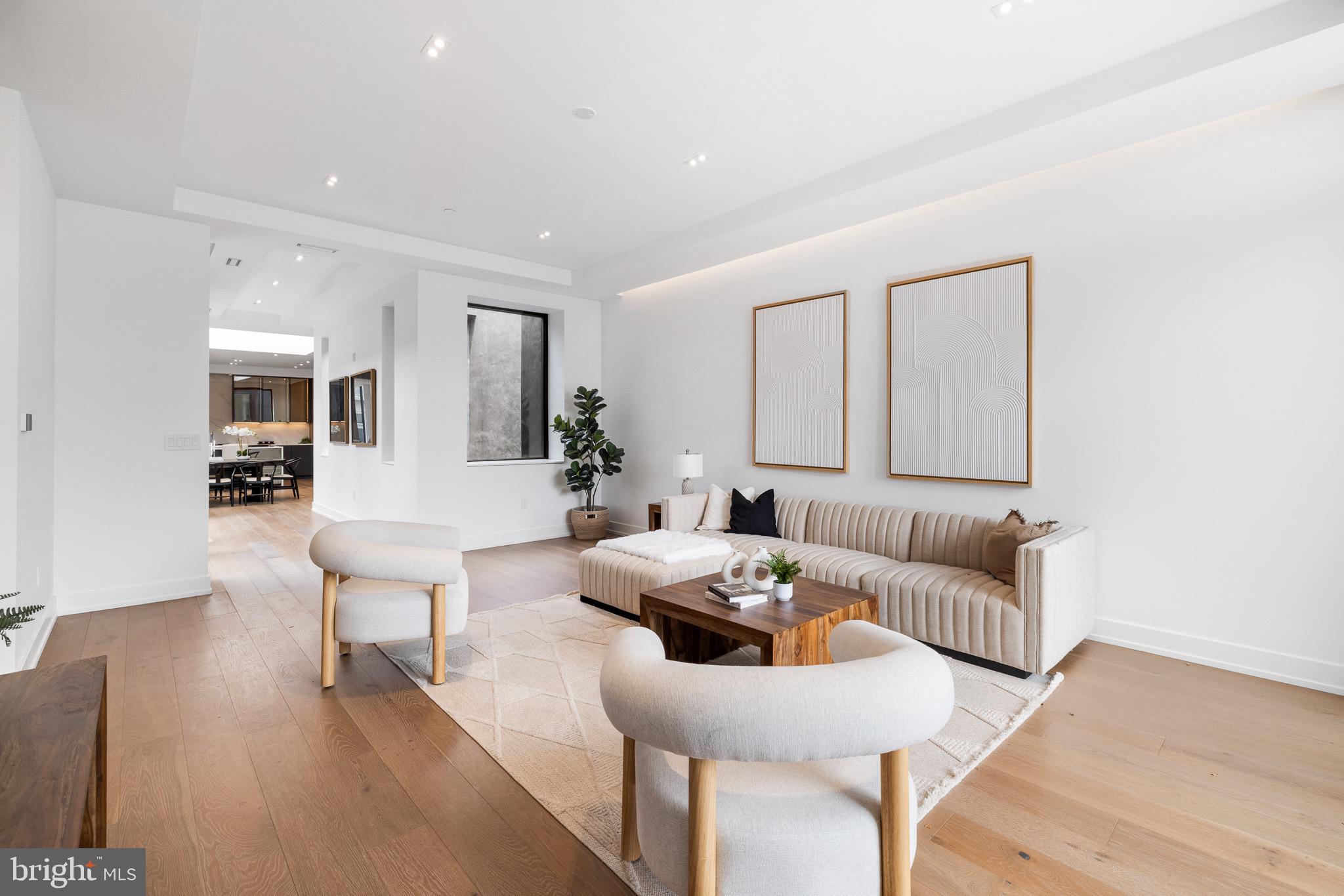124 North 2nd Street, Unit PH Philadelphia, PA 19106 - Photo 30 of 69 a living room with furniture and wooden floor