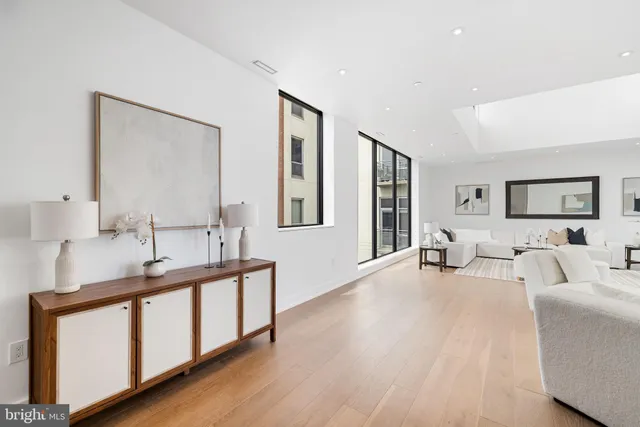 a living room with furniture and white walls