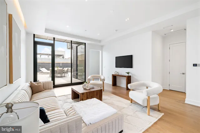 a view of a hallway with a wooden floor
