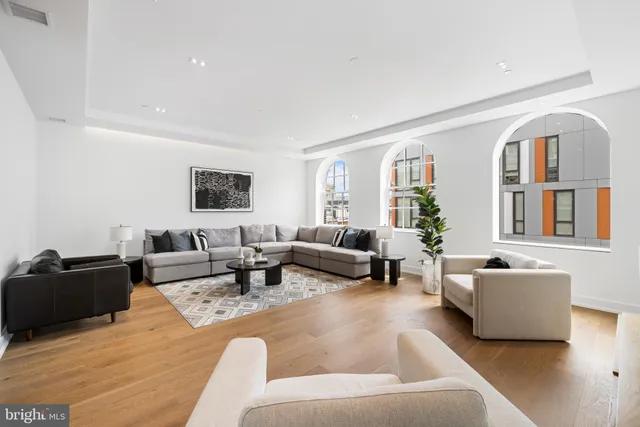 a bathroom with a sink a toilet a shower and a mirror