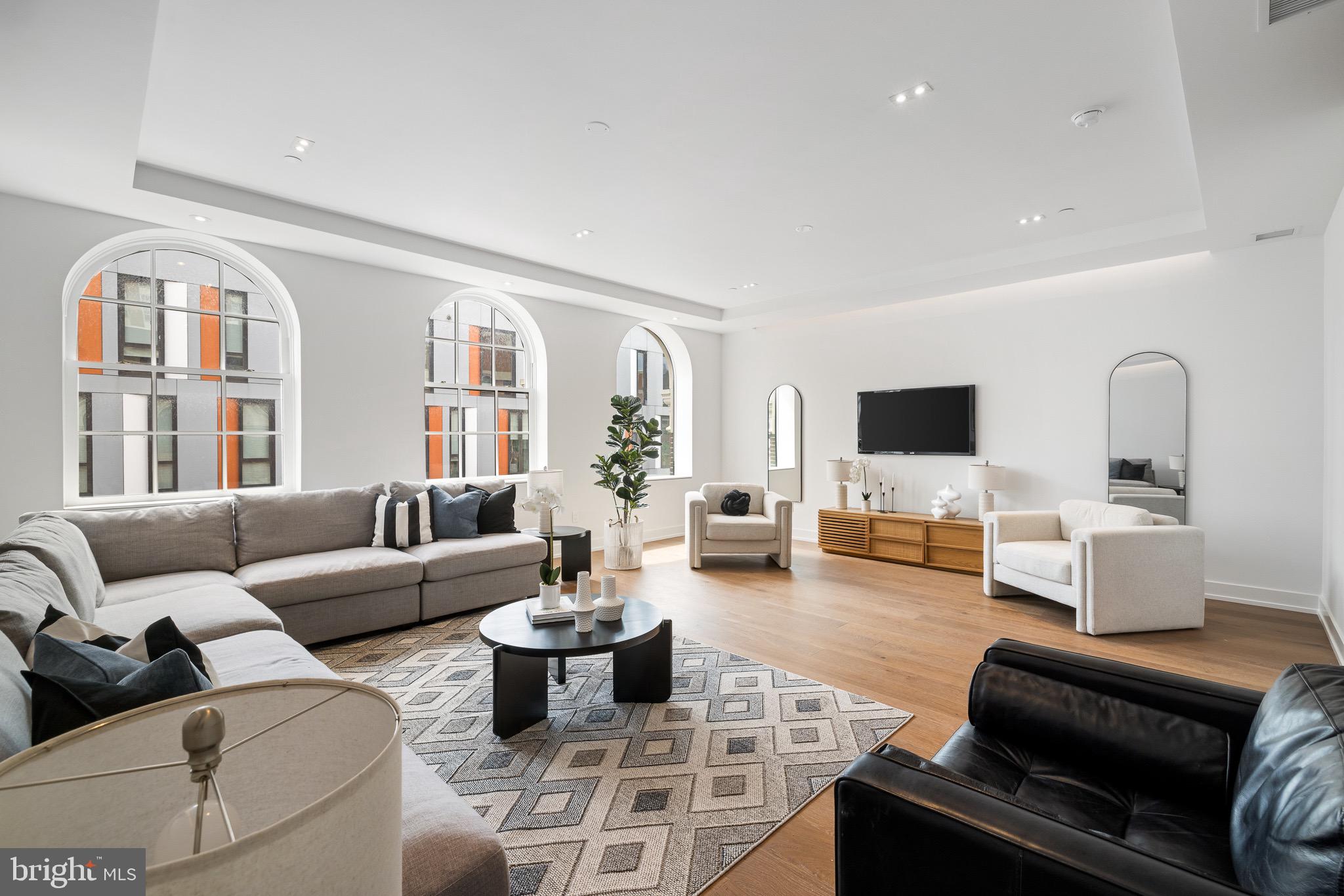 124 North 2nd Street, Unit PH Philadelphia, PA 19106 - Photo 37 of 69 a living room with furniture or couch and a flat screen tv