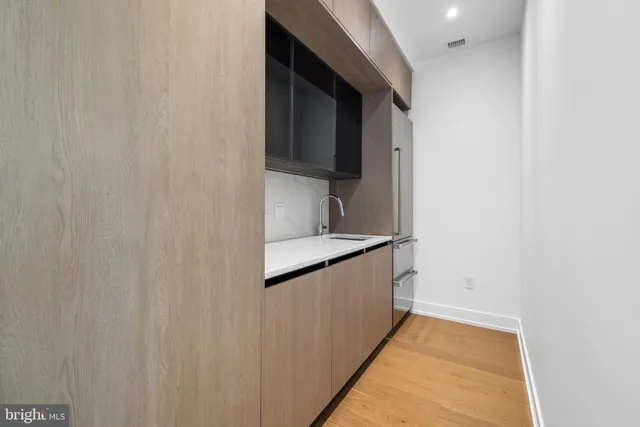a view of a hallway with washer and dryer