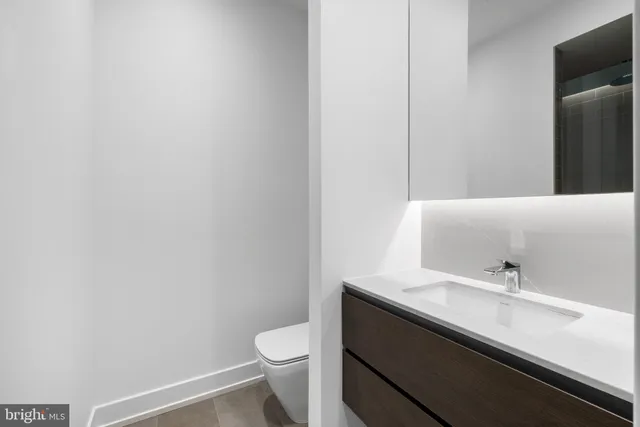 a utility room with sink dryer and washer