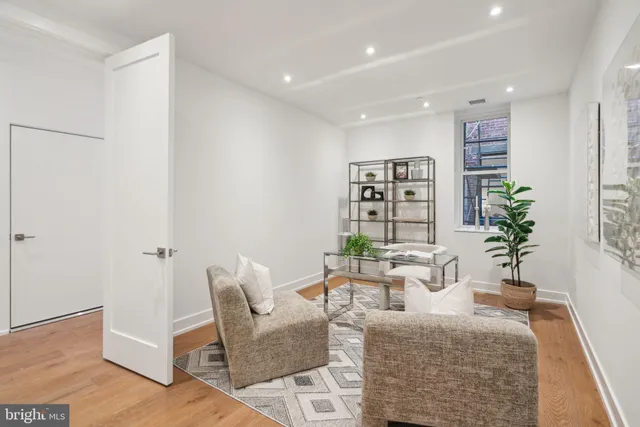 a bedroom with a large bed and a couch