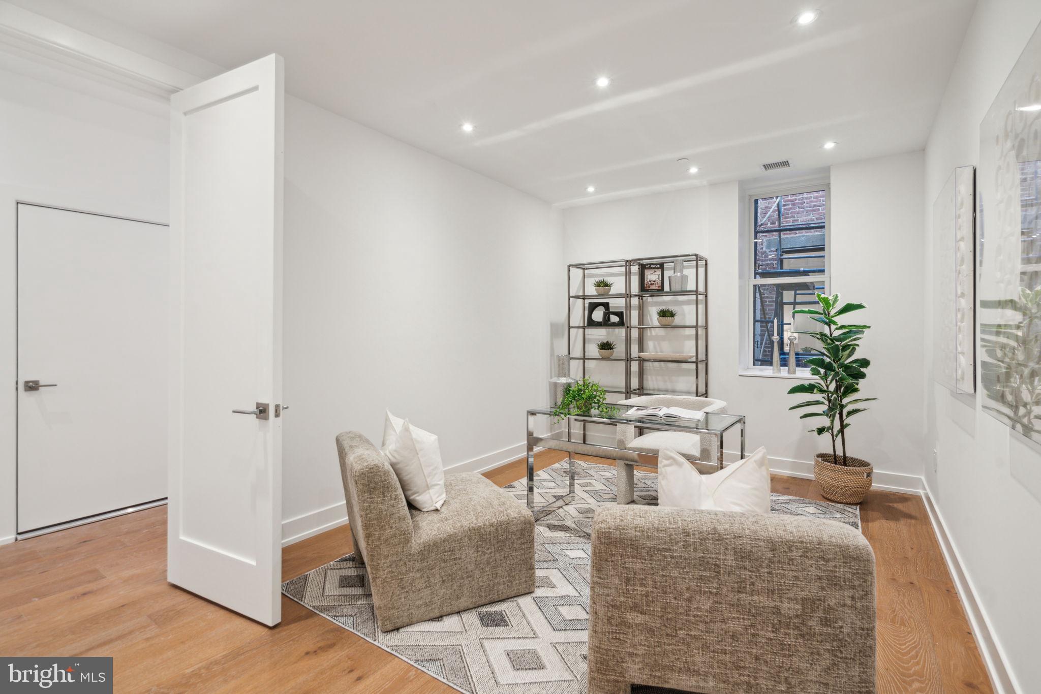 124 North 2nd Street, Unit PH Philadelphia, PA 19106 - Photo 43 of 69 a living room with furniture and wooden floor