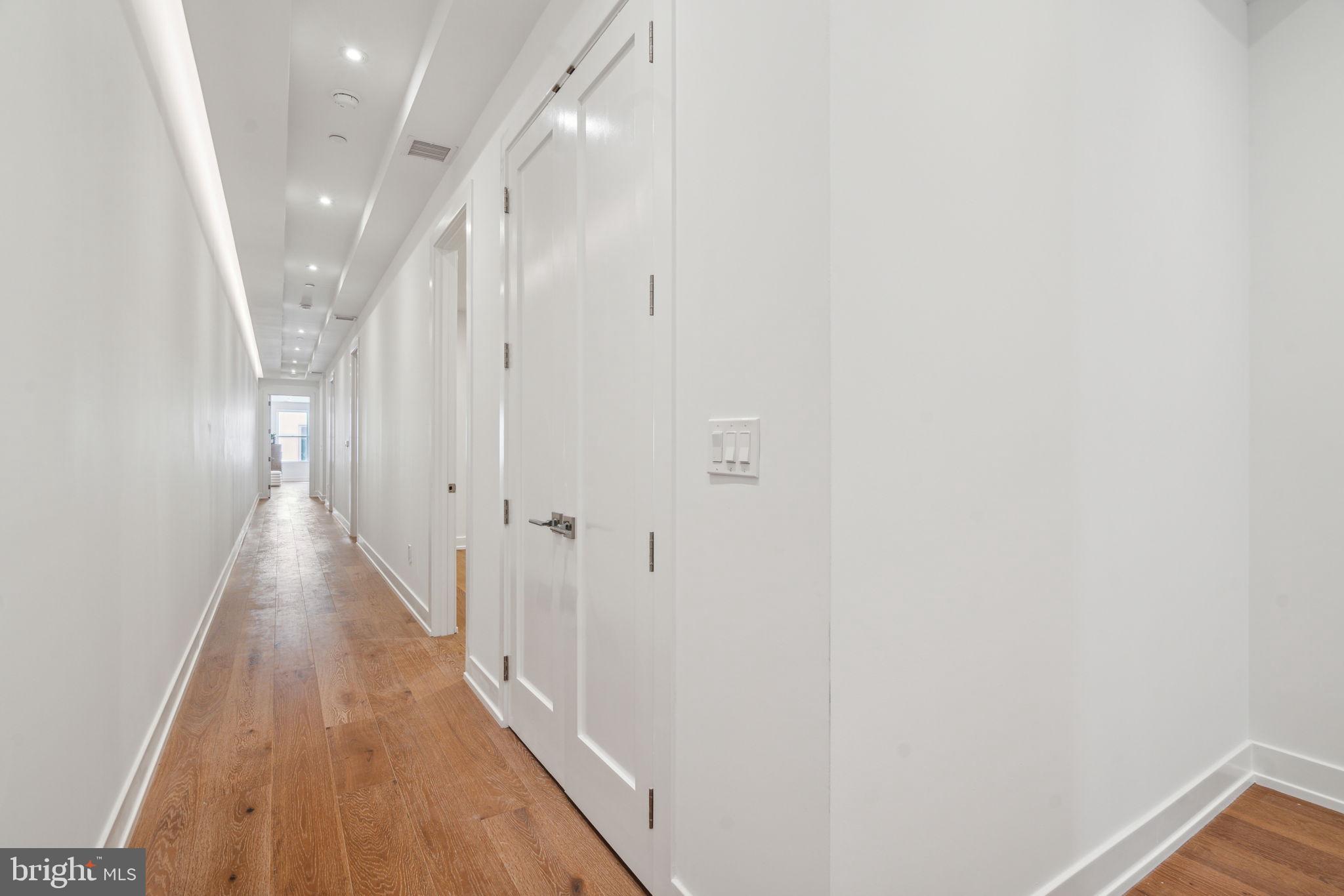 124 North 2nd Street, Unit PH Philadelphia, PA 19106 - Photo 46 of 69 a view of a hallway with wooden floor and staircase