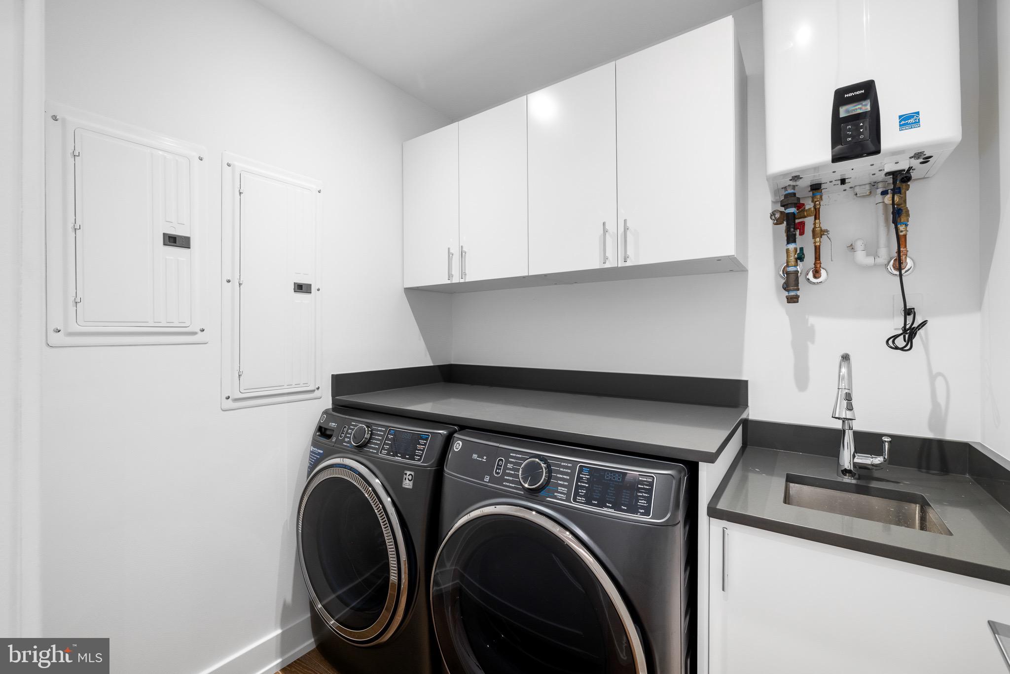 124 North 2nd Street, Unit PH Philadelphia, PA 19106 - Photo 52 of 69 a utility room with sink dryer and washer