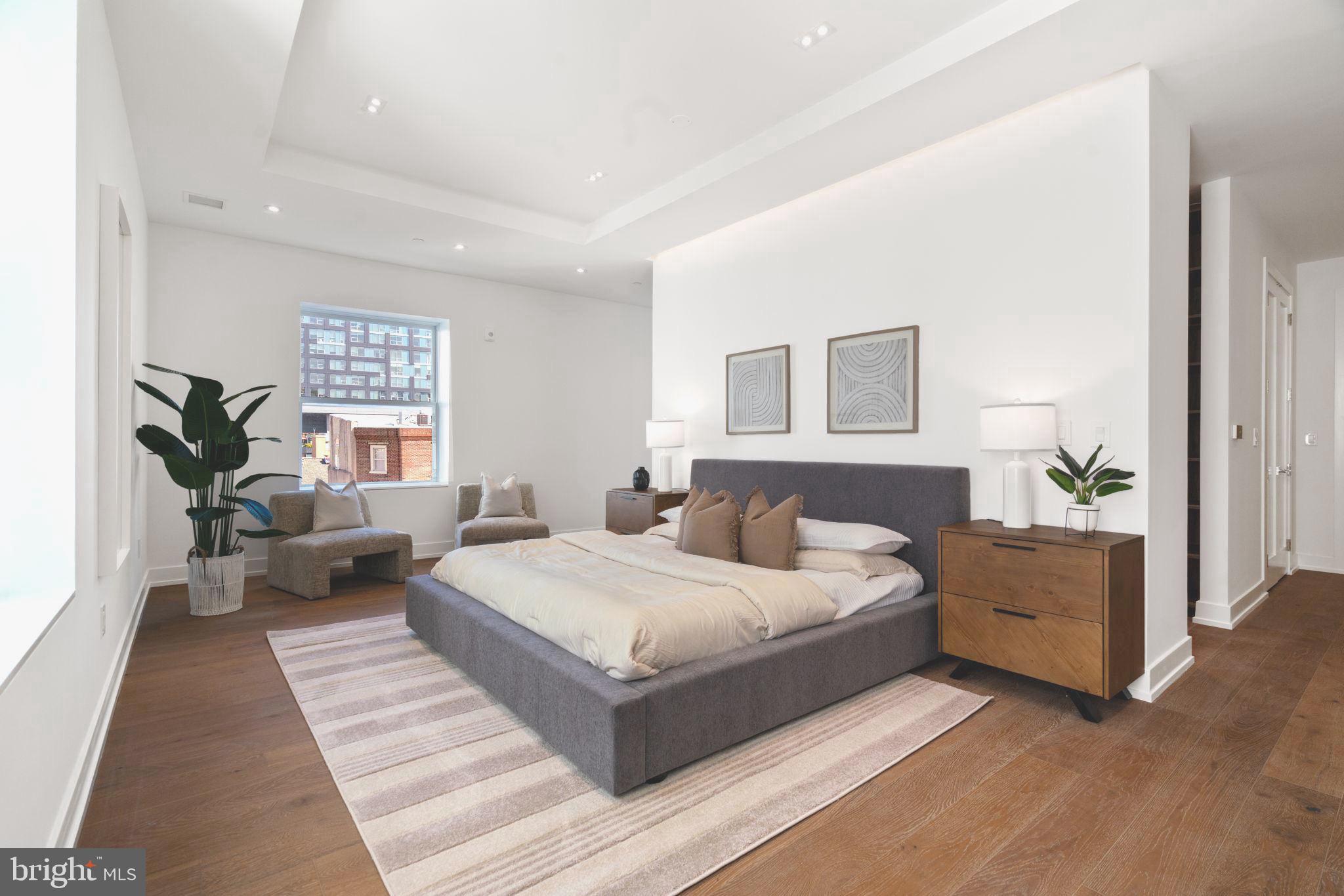 124 North 2nd Street, Unit PH Philadelphia, PA 19106 - Photo 57 of 69 a bedroom with a large bed and a couch