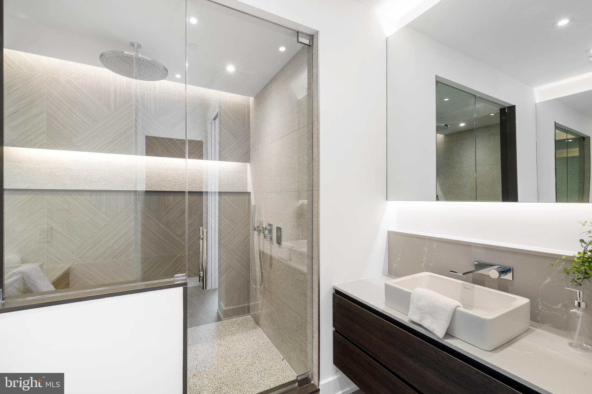 124 North 2nd Street, Unit PH Philadelphia, PA 19106 - Photo 59 of 69 a bathroom with a sink a toilet and a mirror