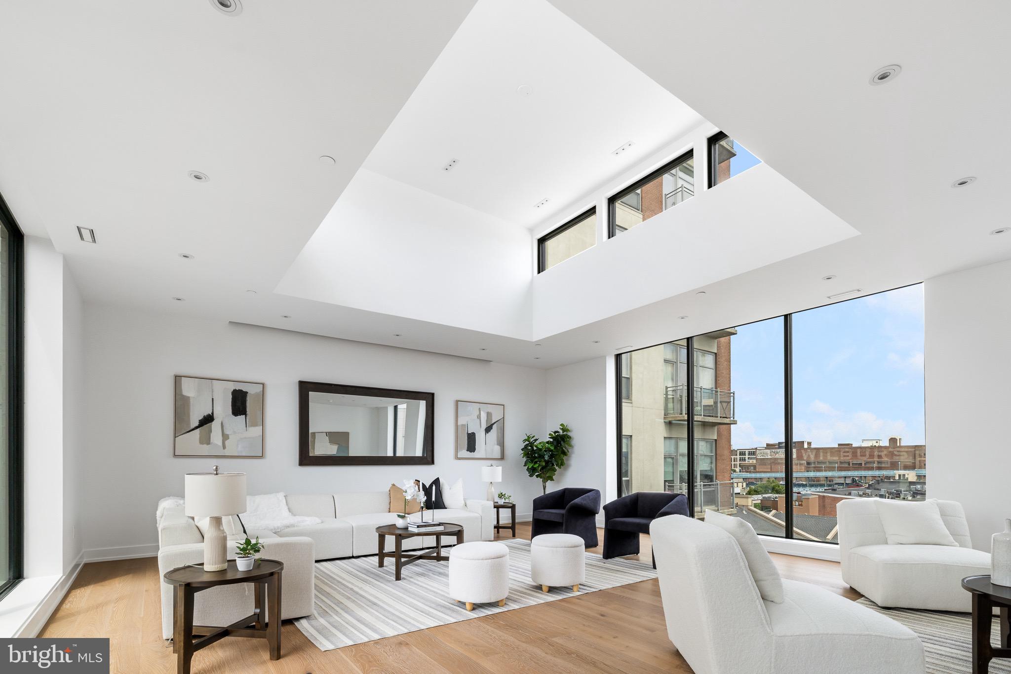 124 North 2nd Street, Unit PH Philadelphia, PA 19106 - Photo 6 of 69 a living room with furniture and large windows
