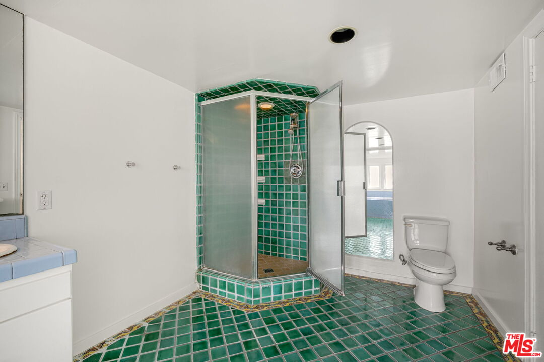 2335 Silver Ridge Avenue Los Angeles, CA 90039 - Photo 12 of 15 a bathroom with a shower a toilet and a sink