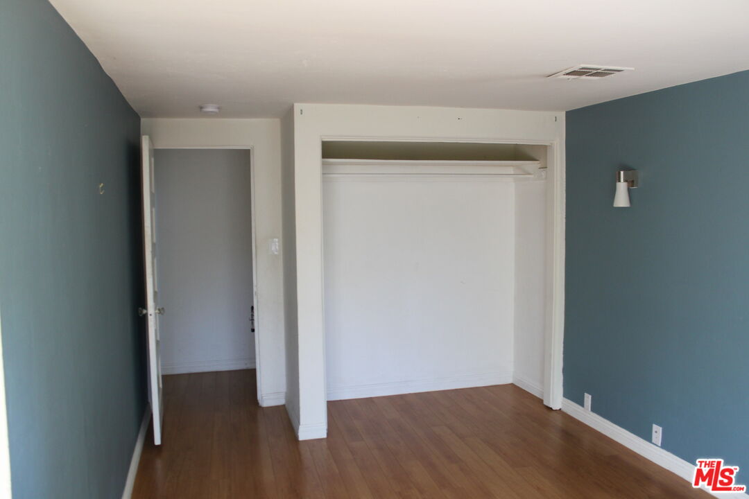 2335 Silver Ridge Avenue Los Angeles, CA 90039 - Photo 16 of 17 a view of an empty room with wooden floor