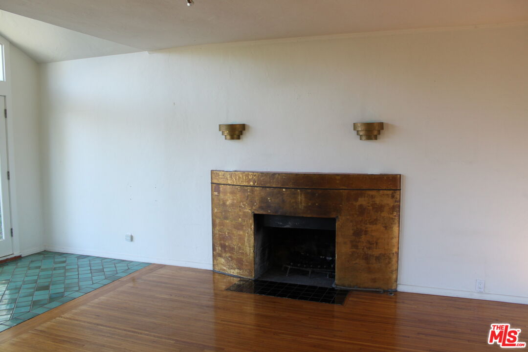 2335 Silver Ridge Avenue Los Angeles, CA 90039 - Photo 17 of 17 a living room with a fireplace