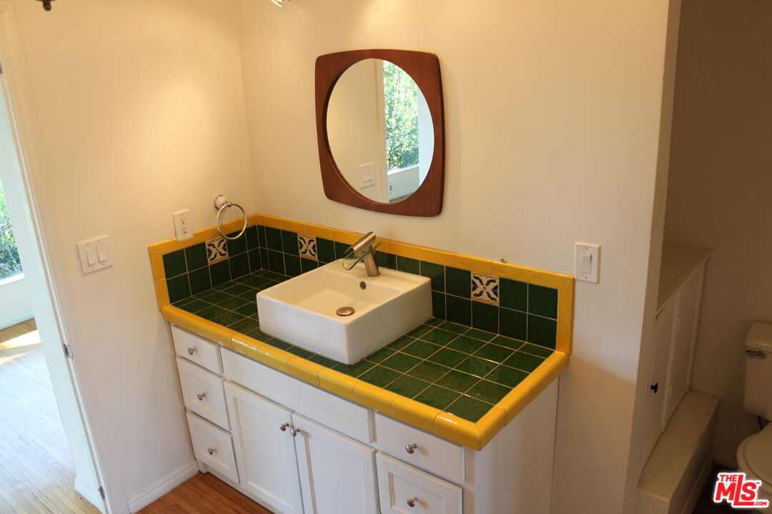 2335 Silver Ridge Avenue Los Angeles, CA 90039 - Photo 2 of 17 a bathroom with a sink and a mirror