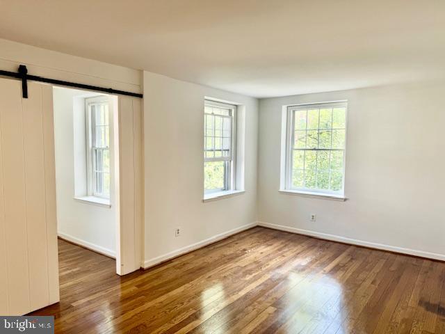 3720 39th Street Northwest, Unit D166 Washington, DC 20016 - Photo 11 of 58 Living room with sliding door to den