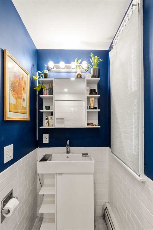 3 Kenney Street, Unit 2 Boston, MA 02130 - Photo 10 of 24 a bathroom with a sink and a mirror