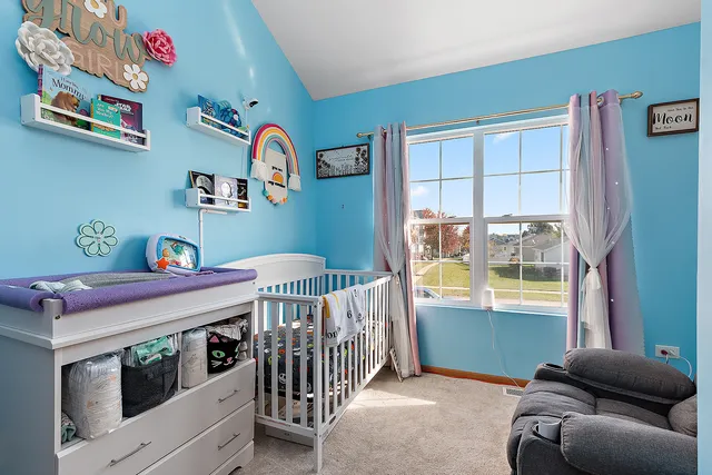 a bedroom with furniture and a window