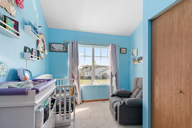 a kitchen with a refrigerator and cabinets