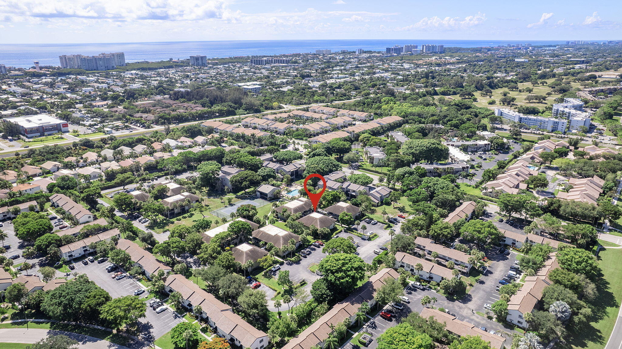 159 Northwest 70th Street, Unit 603 Boca Raton, FL 33487 - Photo 33 of 35 an aerial view of a city with lots of residential buildings