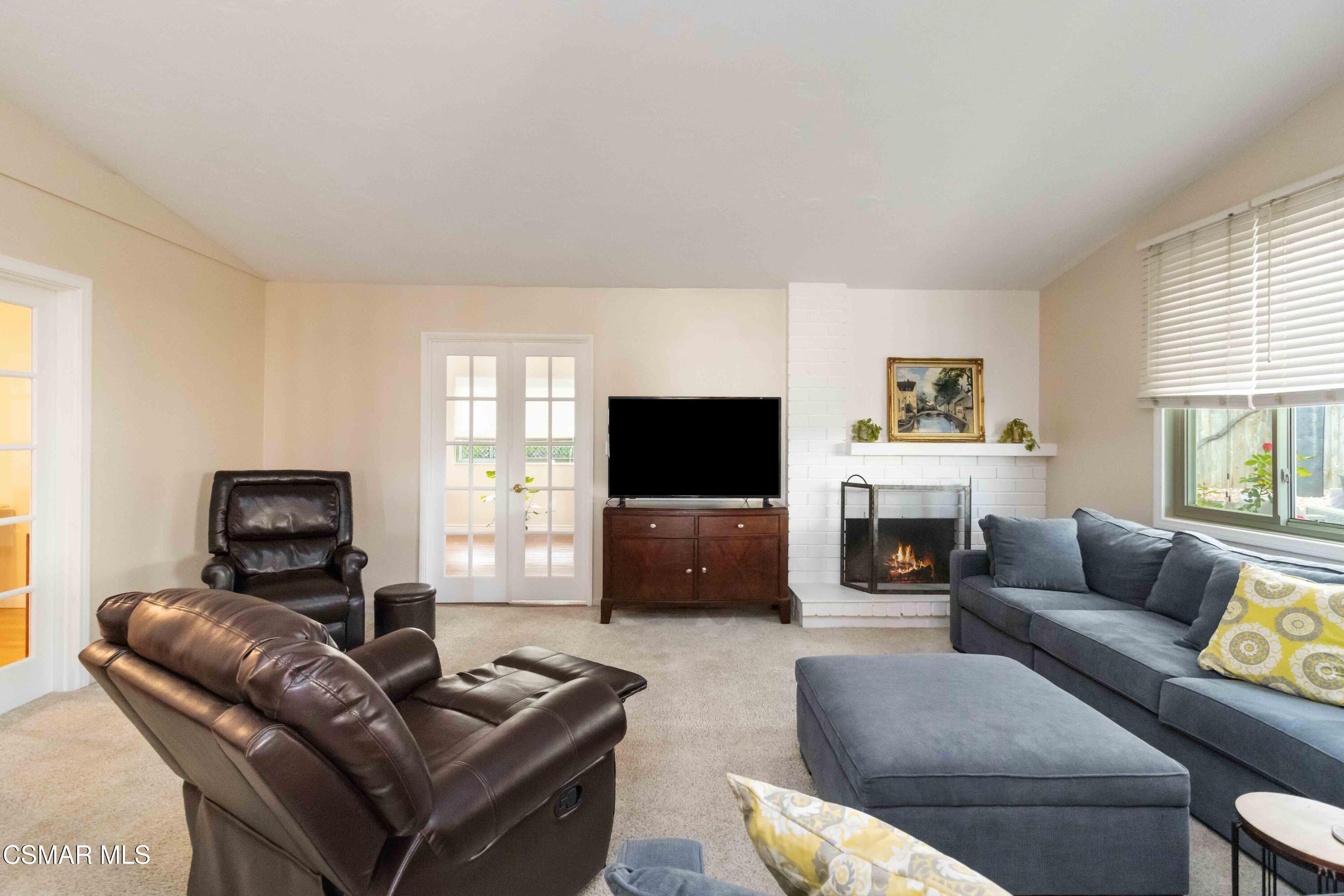 705 Wishard Avenue Simi Valley, CA 93065 - Photo 14 of 50 a living room with furniture a flat screen tv and a window