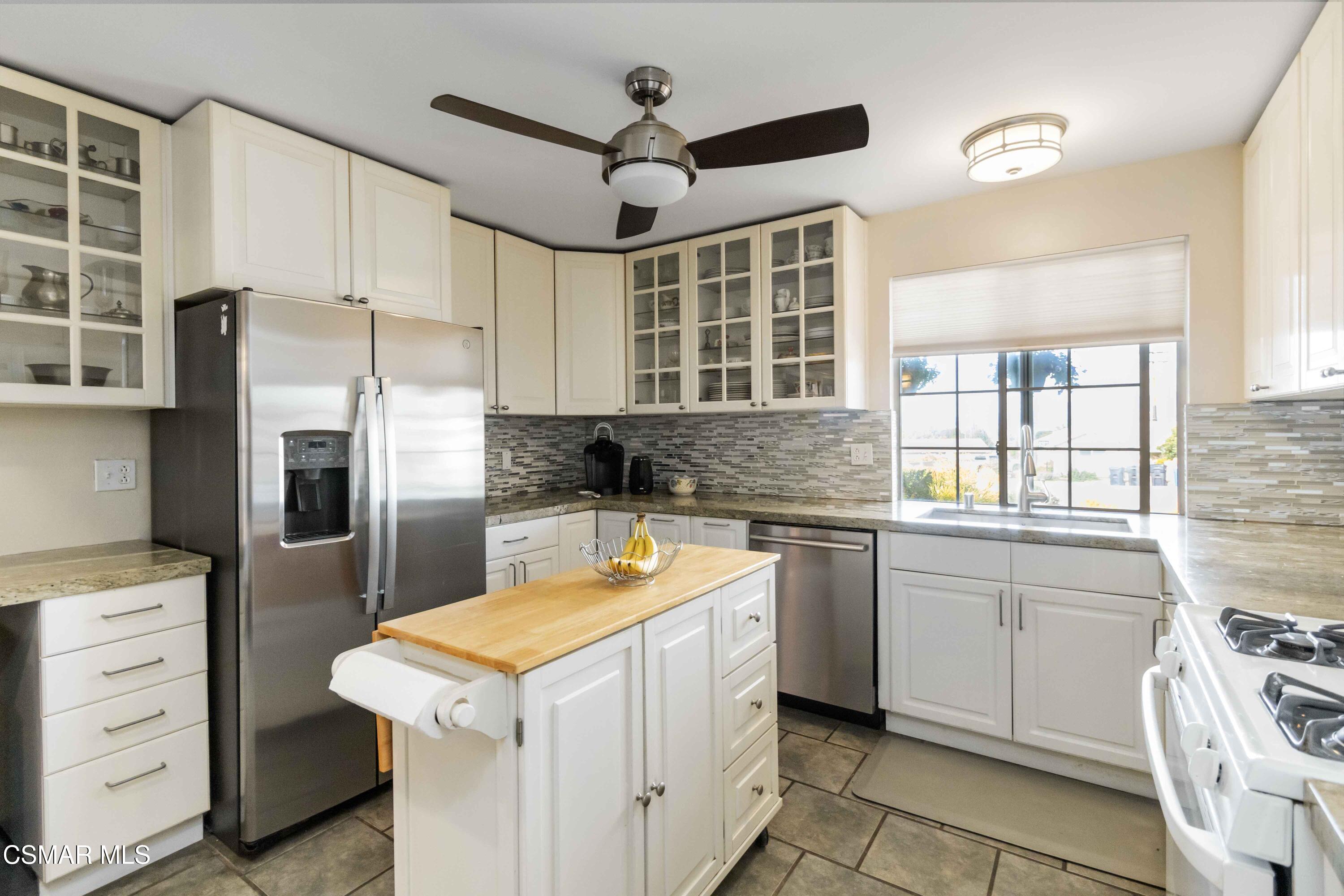 705 Wishard Avenue Simi Valley, CA 93065 - Photo 16 of 50 a kitchen with a stove oven and sink