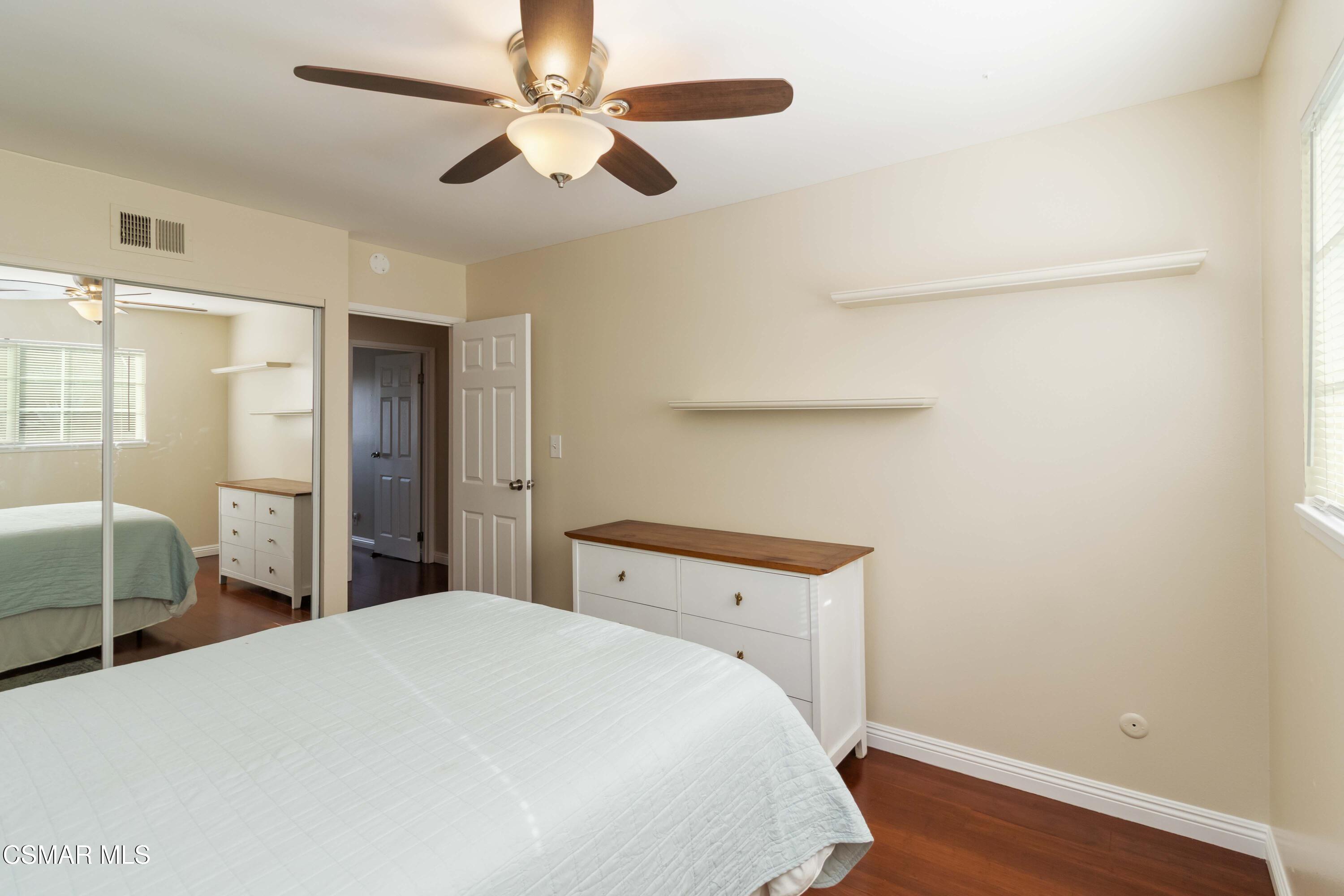 705 Wishard Avenue Simi Valley, CA 93065 - Photo 19 of 50 a bedroom with a bed and a chandelier