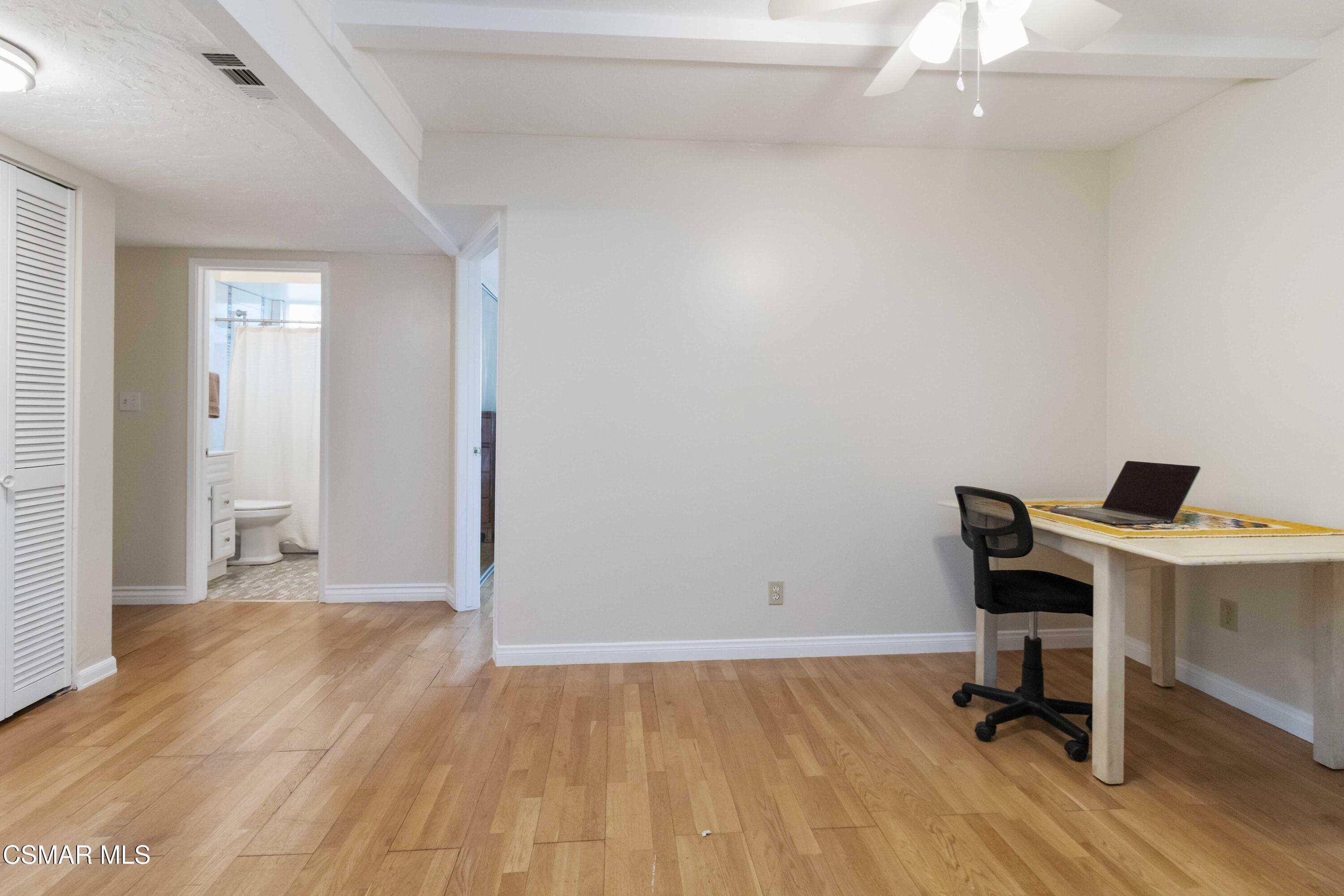 705 Wishard Avenue Simi Valley, CA 93065 - Photo 34 of 50 a view of a workspace with furniture and wooden floor