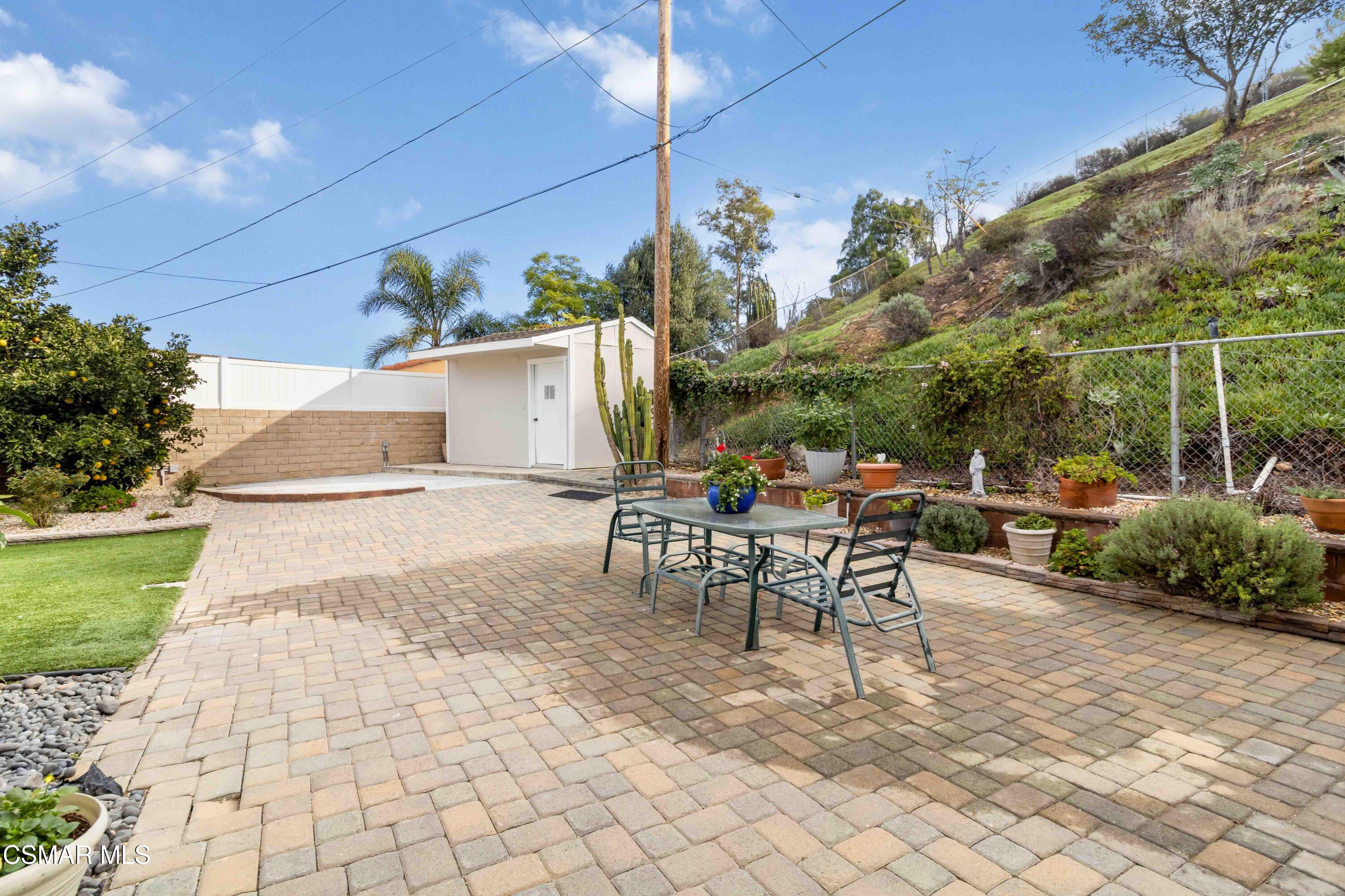 705 Wishard Avenue Simi Valley, CA 93065 - Photo 35 of 50 a view of a patio with table and chairs with plants and plants
