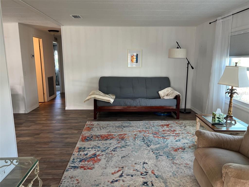 576 Queen Palm Largo, FL 33778 - Photo 12 of 33 a living room with furniture and a couch