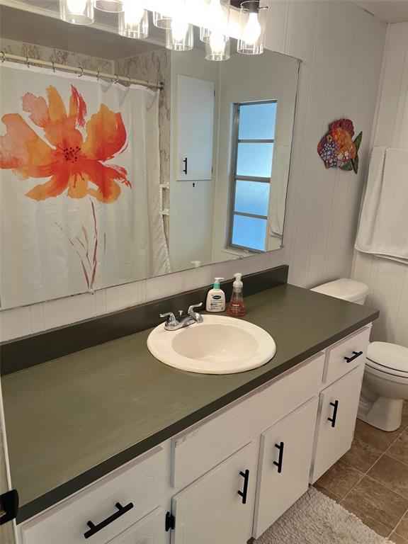 576 Queen Palm Largo, FL 33778 - Photo 16 of 33 a bathroom with a sink and a mirror