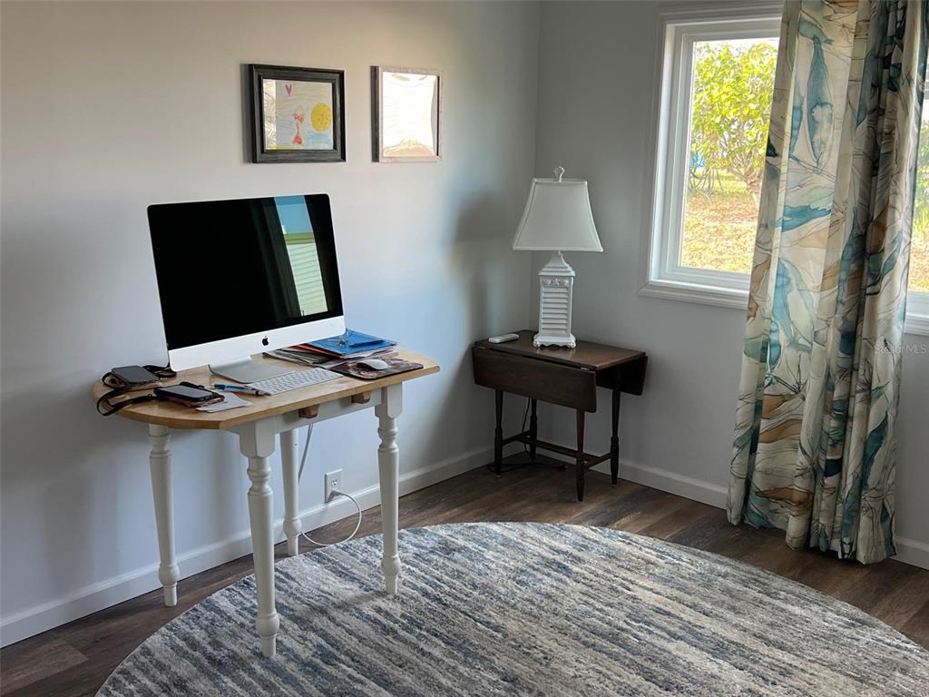 576 Queen Palm Largo, FL 33778 - Photo 19 of 33 a view of a workspace with furniture and a window