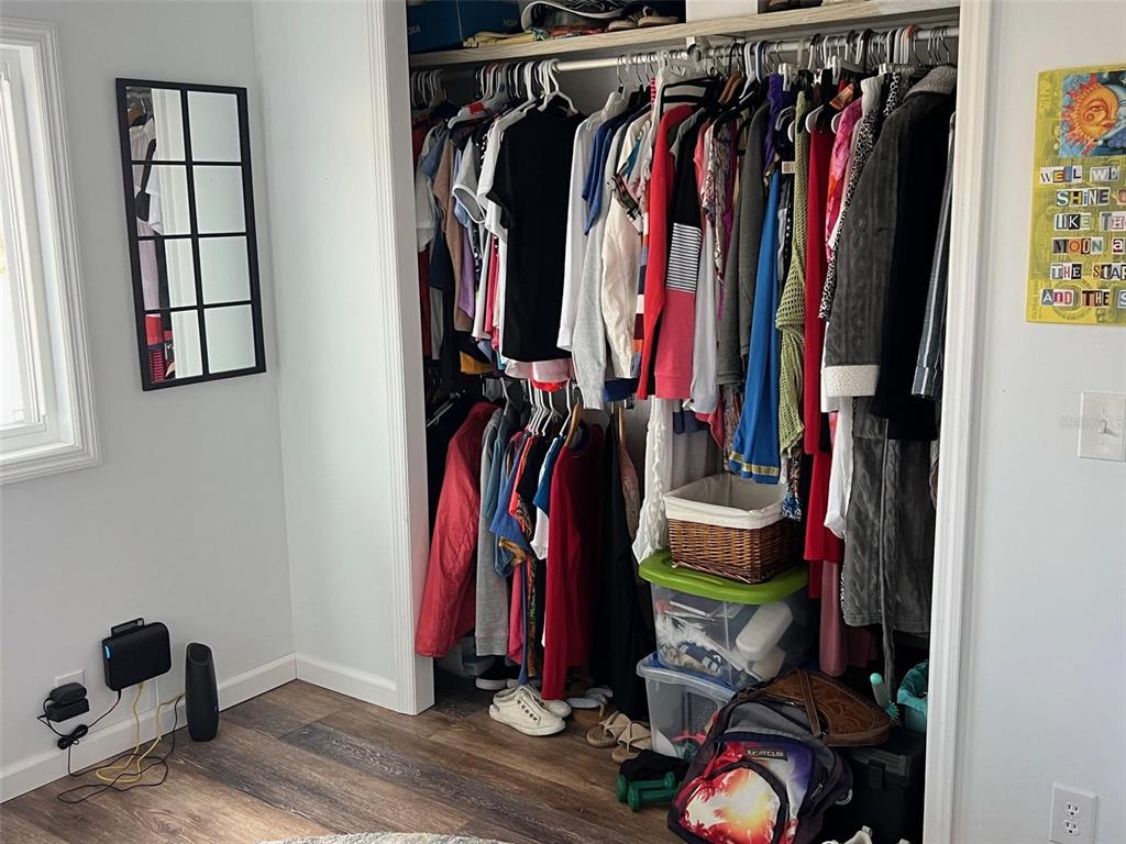 576 Queen Palm Largo, FL 33778 - Photo 21 of 33 a view of walk in closet with clothes