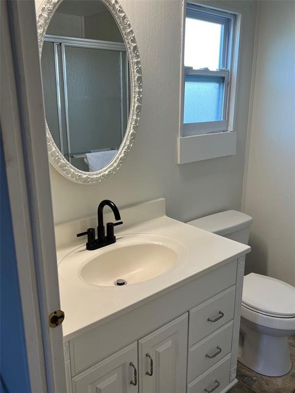 576 Queen Palm Largo, FL 33778 - Photo 29 of 33 a bathroom with a sink and a mirror