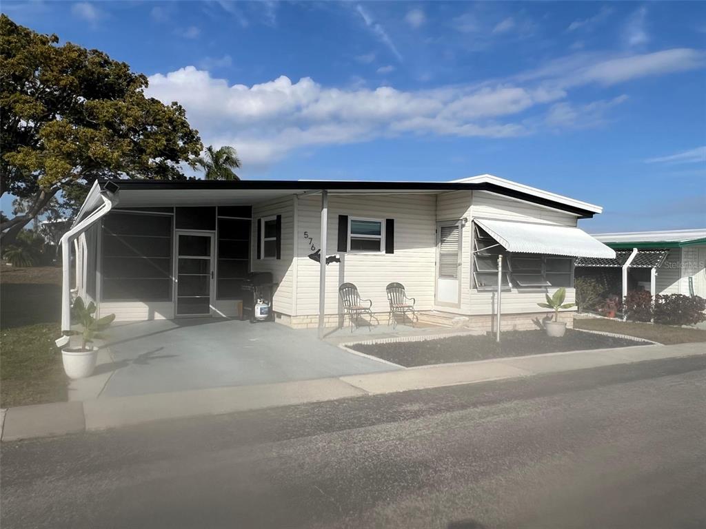 576 Queen Palm Largo, FL 33778 - Photo 3 of 33 front view of a house with a patio